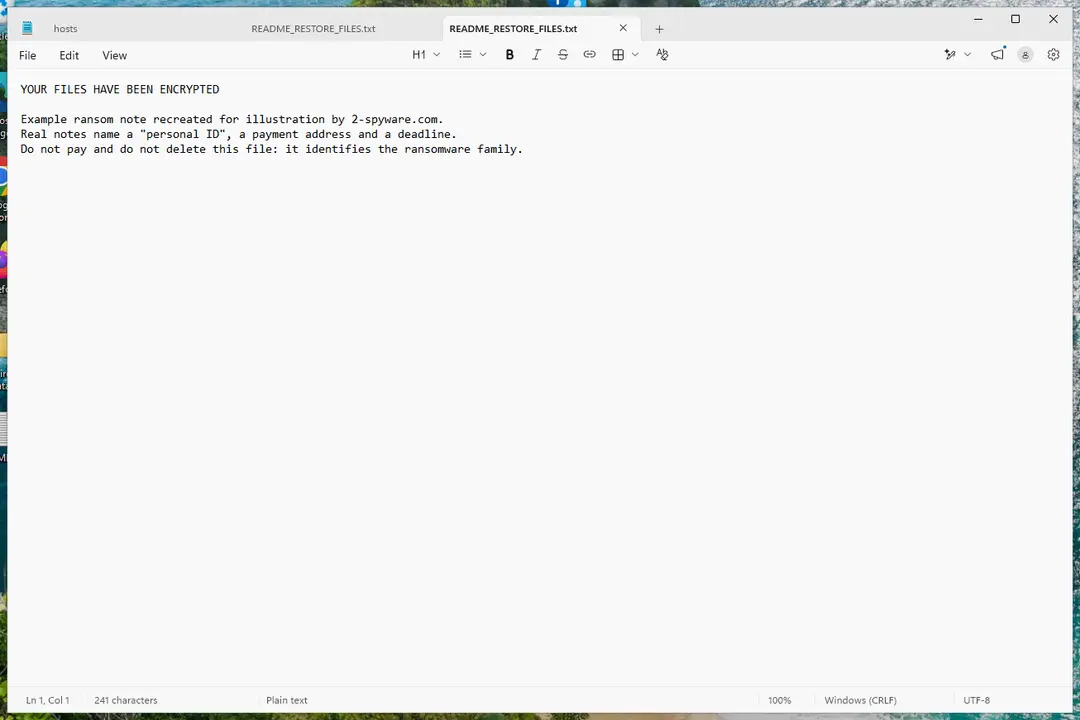 A ransom note text file next to encrypted files in File Explorer